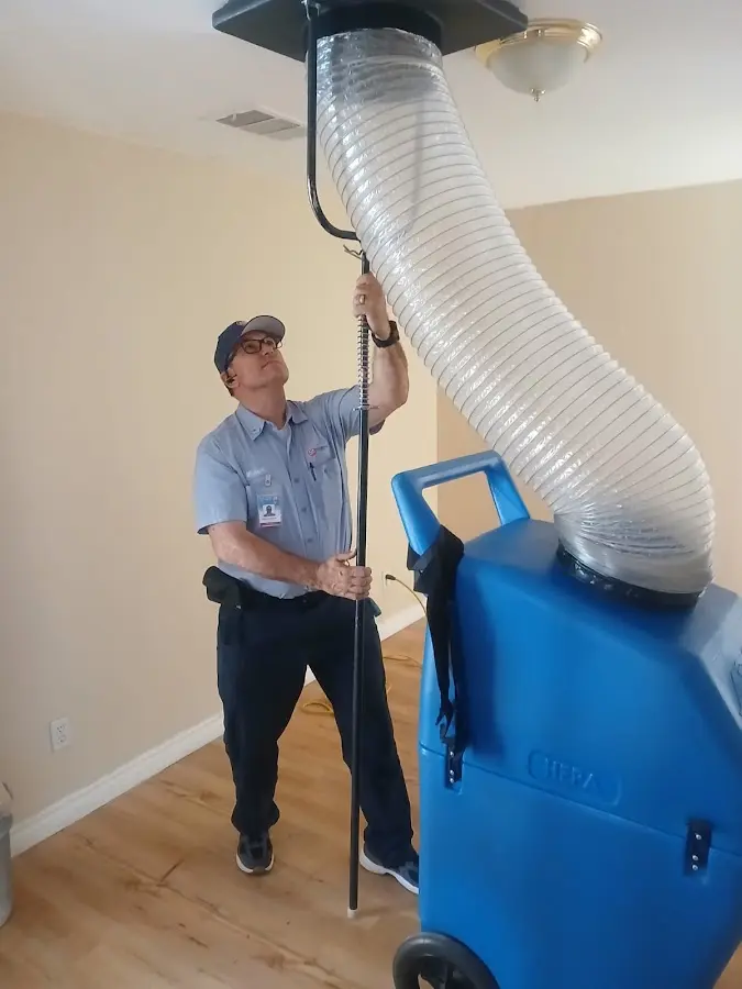 Furnace Tune-Up technician using HEPA equipment in Cresskill